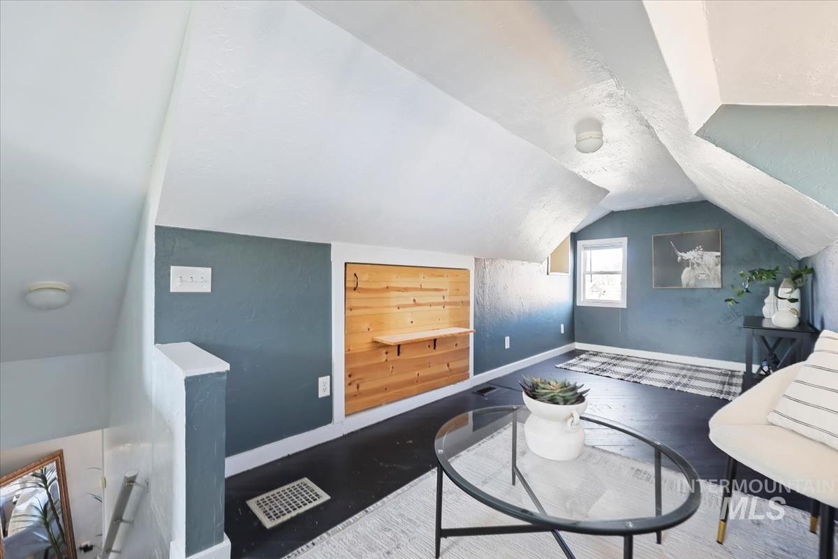 3111 West Palouse Street Boise, ID 83705 - Photo 27 of 32 Living area with baseboards and wood finished floors