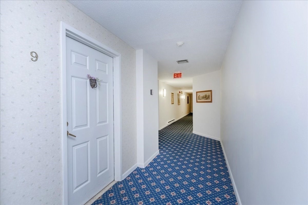 9 Ledgewood Way, Unit 9 Peabody, MA 01960 - Photo 8 of 42 a view of a hallway