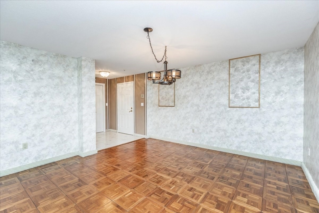 9 Ledgewood Way, Unit 9 Peabody, MA 01960 - Photo 10 of 42 a view of a kitchen with wooden floor and refrigerator