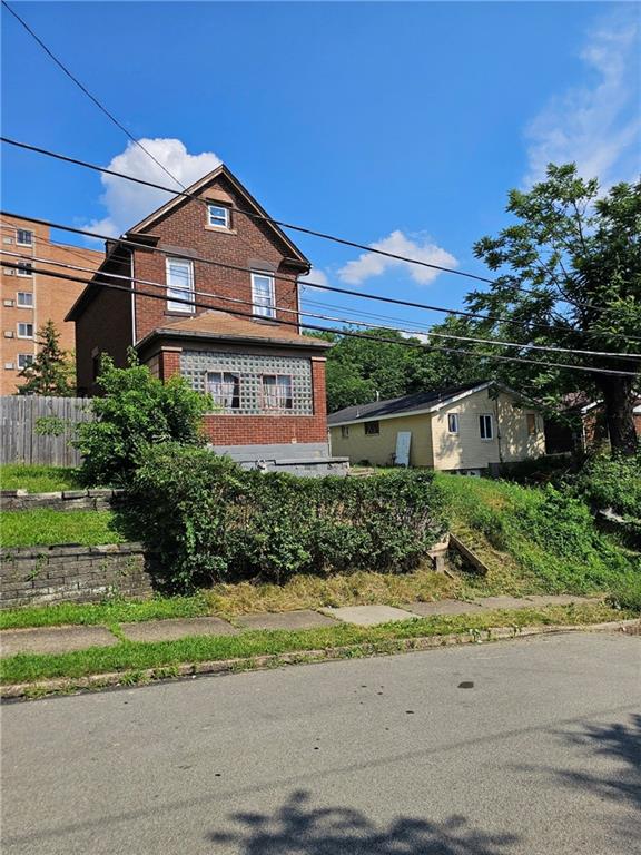 564 3rd Street Clairton, PA 15025 - Photo 1 of 20 a front view of a house with a yard