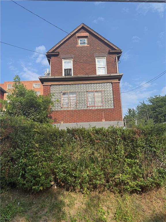 564 3rd Street Clairton, PA 15025 - Photo 2 of 20 a view of a house with a small yard and large tree