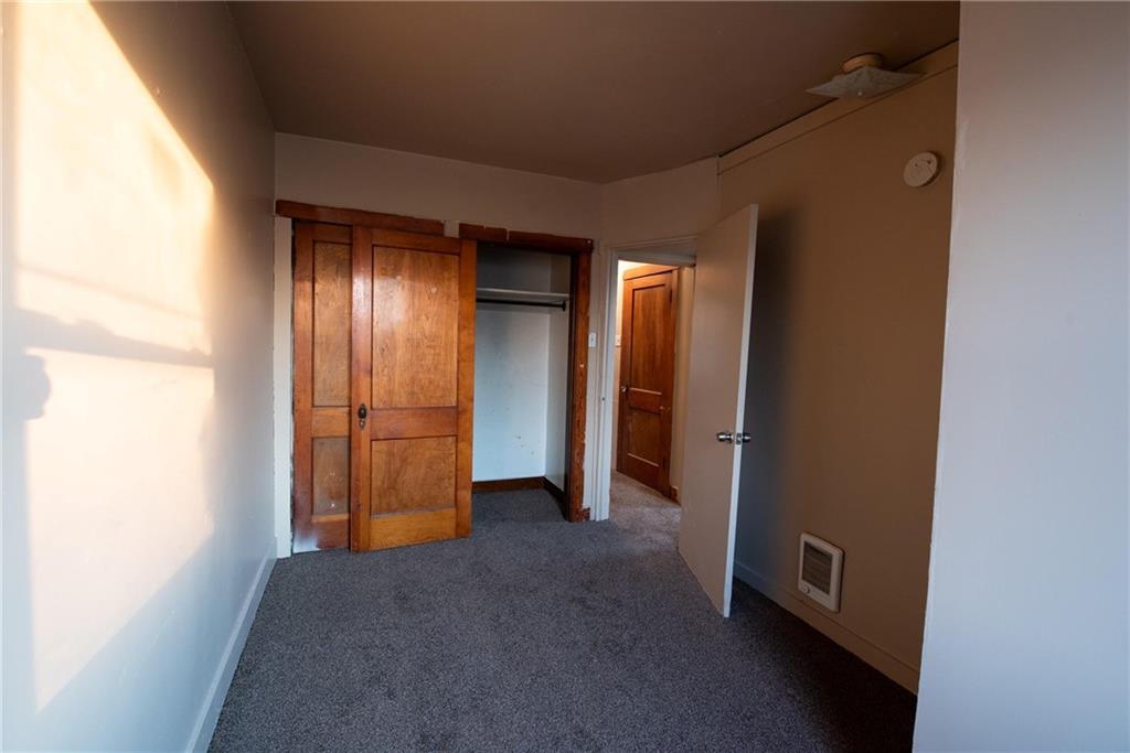 564 3rd Street Clairton, PA 15025 - Photo 8 of 20 a view of empty room with wooden floor
