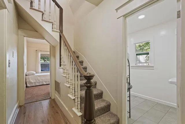 a bedroom with a large bed and a large window