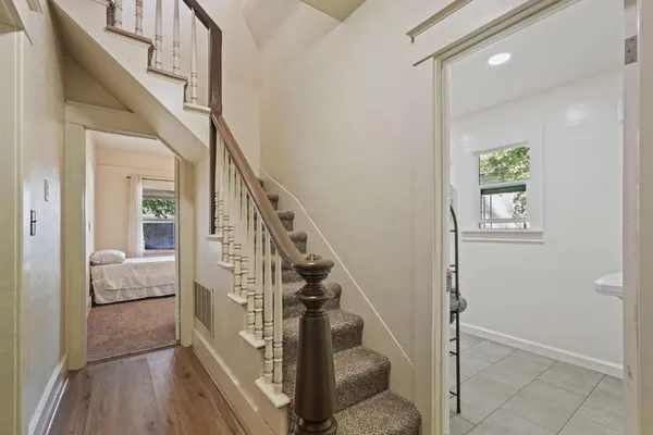 a bedroom with a large bed and a large window