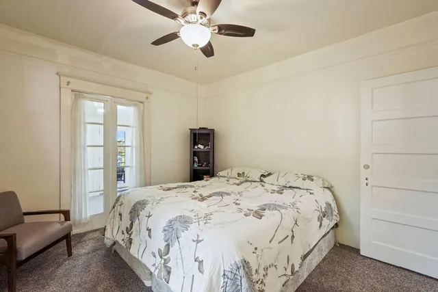 a kitchen with granite countertop a stove a sink and a microwave