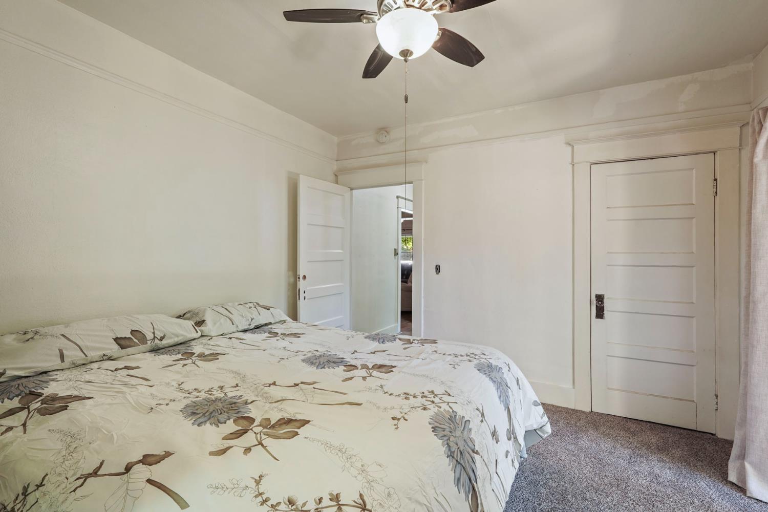 18529 Highway 88 Clements, CA 95237 - Photo 17 of 42 a spacious bedroom with a bed and cabinets