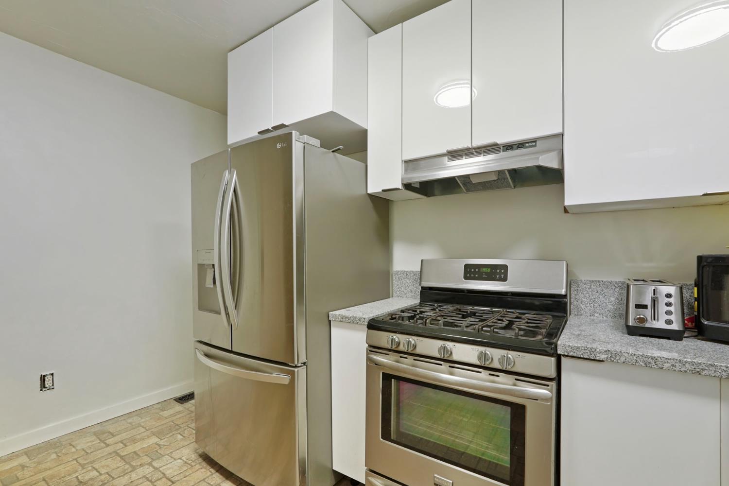 18529 Highway 88 Clements, CA 95237 - Photo 20 of 42 a kitchen with stainless steel appliances granite countertop a refrigerator sink and stove