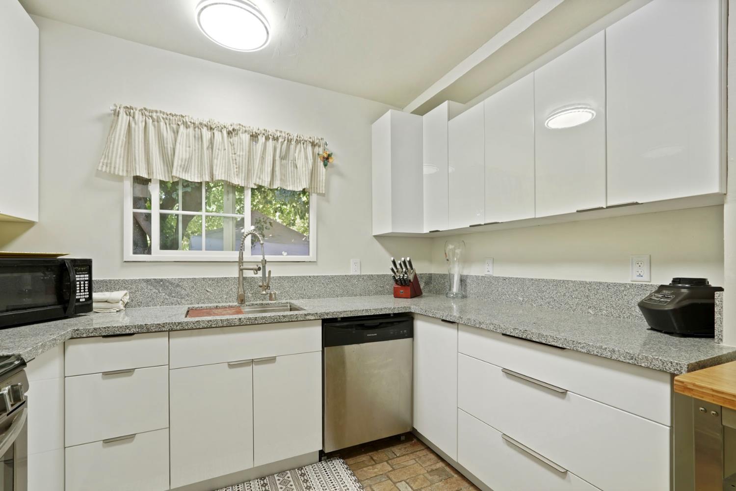 18529 Highway 88 Clements, CA 95237 - Photo 21 of 42 a kitchen with a sink stove and cabinets