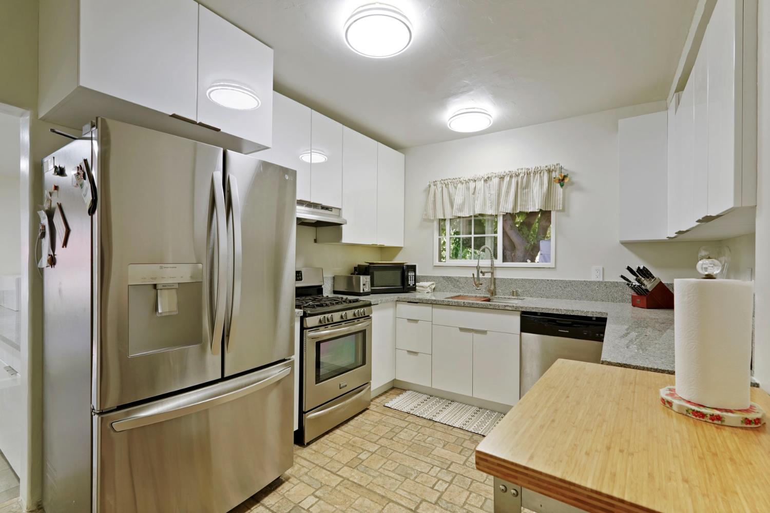 18529 Highway 88 Clements, CA 95237 - Photo 22 of 42 a kitchen with a refrigerator sink and stove