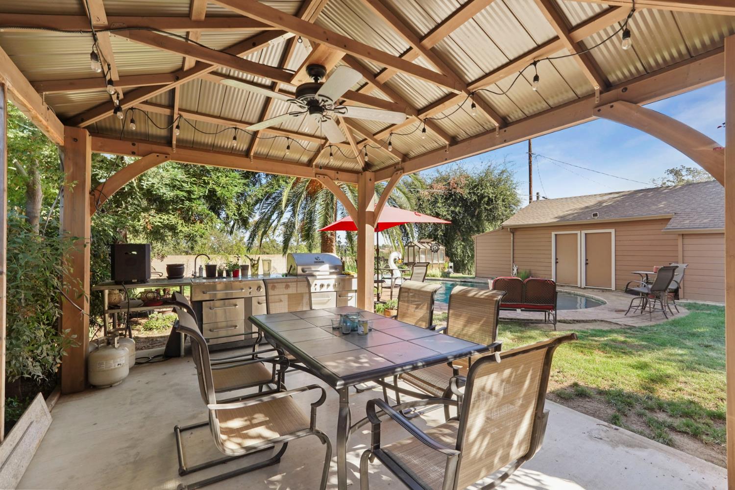 18529 Highway 88 Clements, CA 95237 - Photo 36 of 42 a view of a patio with table and chairs and potted plants