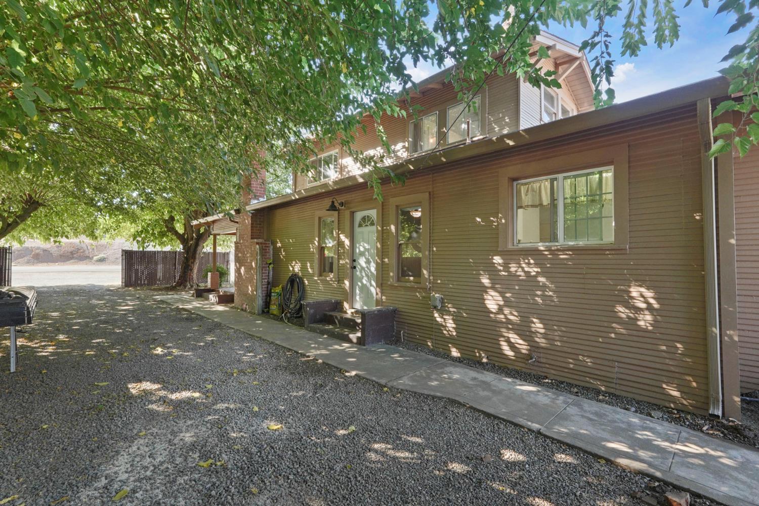 18529 Highway 88 Clements, CA 95237 - Photo 4 of 42 a view of a house with a yard