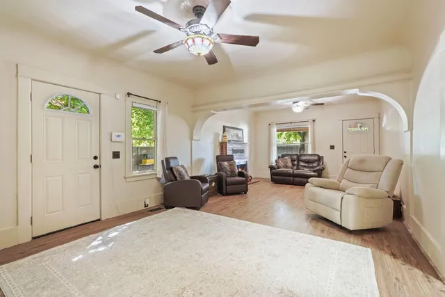 a view of entryway with wooden floor and stairs
