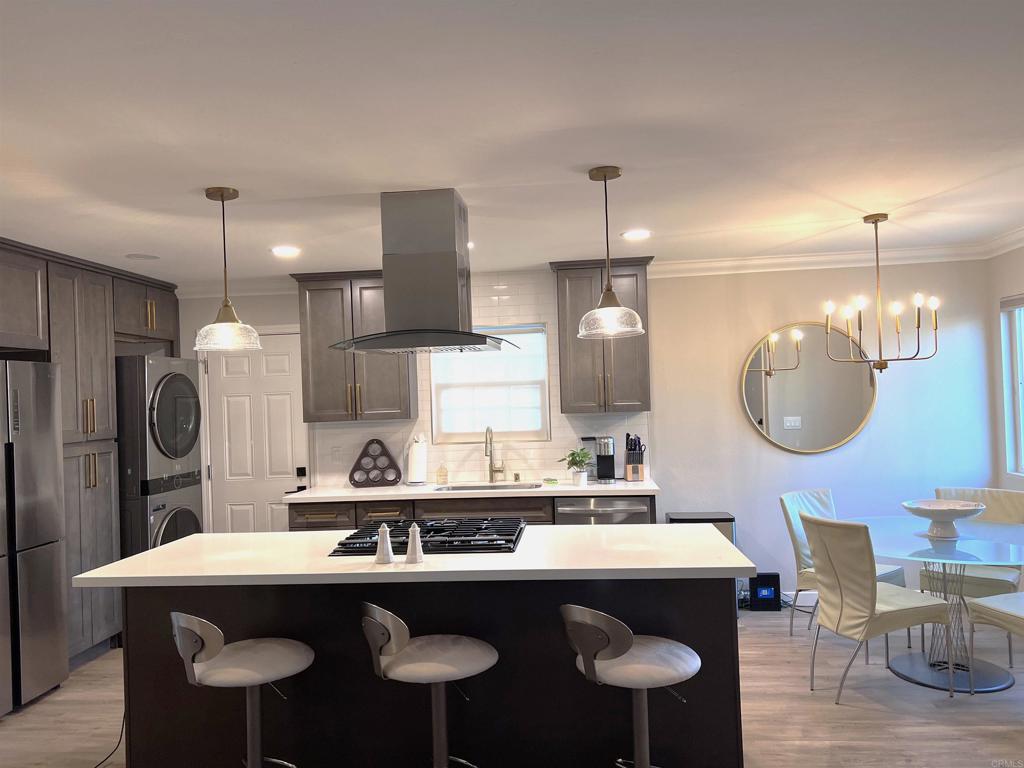 3589 Nina Street Oceanside, CA 92056 - Photo 1 of 33 a kitchen with a table chairs stove and refrigerator