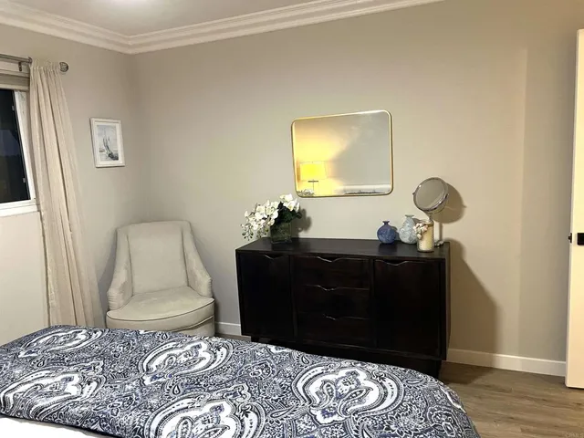 a bedroom with a bed and a lamp
