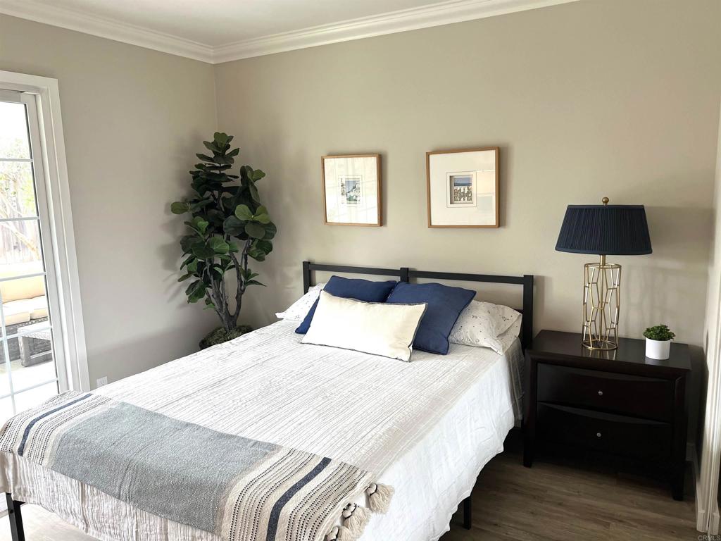 3589 Nina Street Oceanside, CA 92056 - Photo 15 of 33 a bedroom with a bed and a potted plant