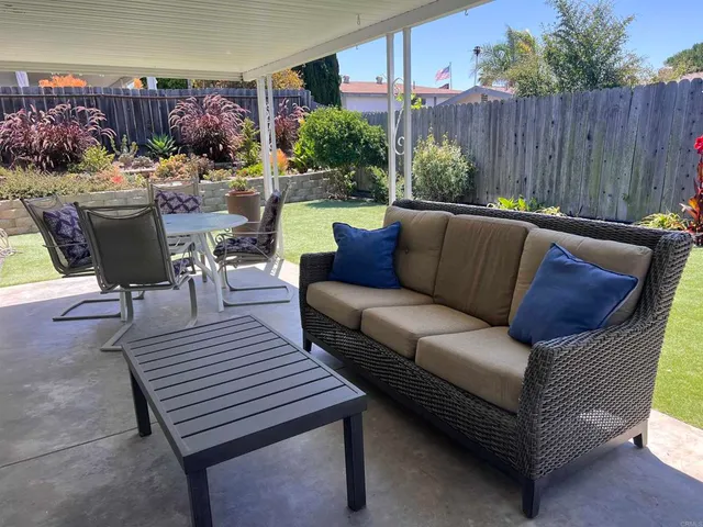 a outdoor living space with furniture and garden view