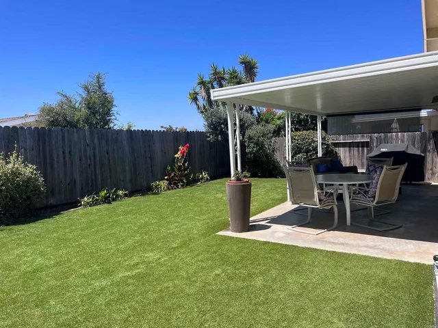 a view of a chairs and tables in the patio