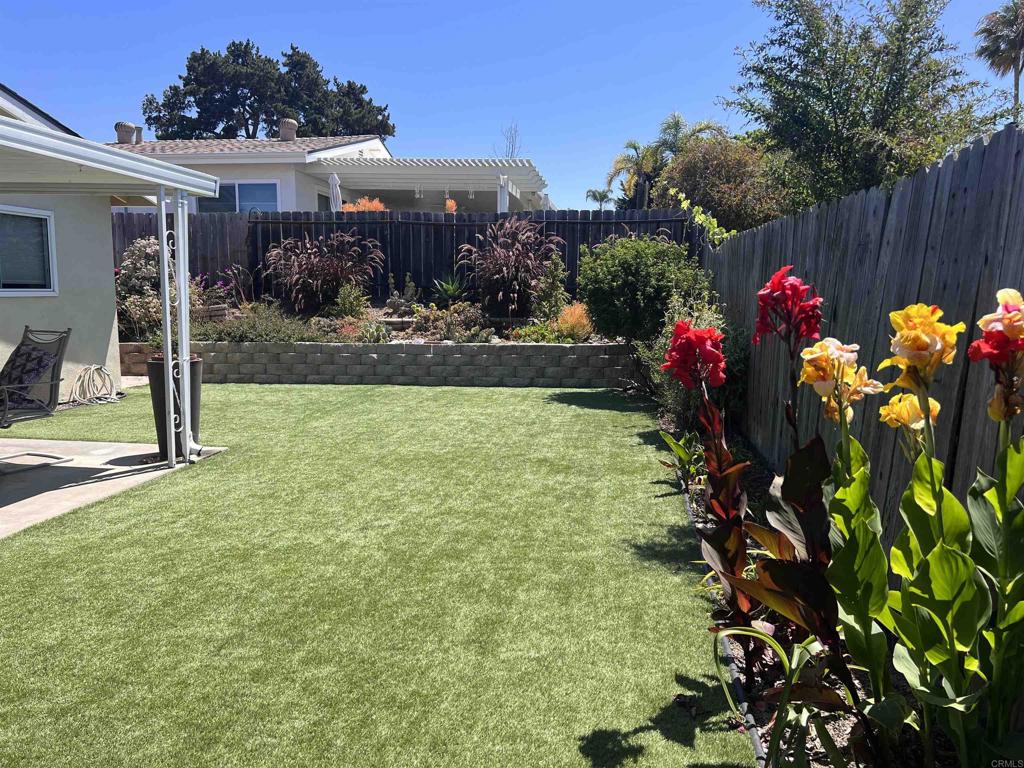 3589 Nina Street Oceanside, CA 92056 - Photo 24 of 33 a view of a house with a flower garden