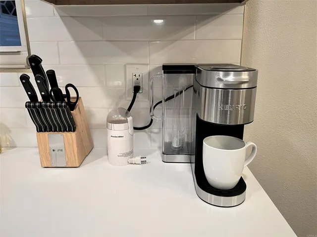 a bathroom with a toilet and a mirror