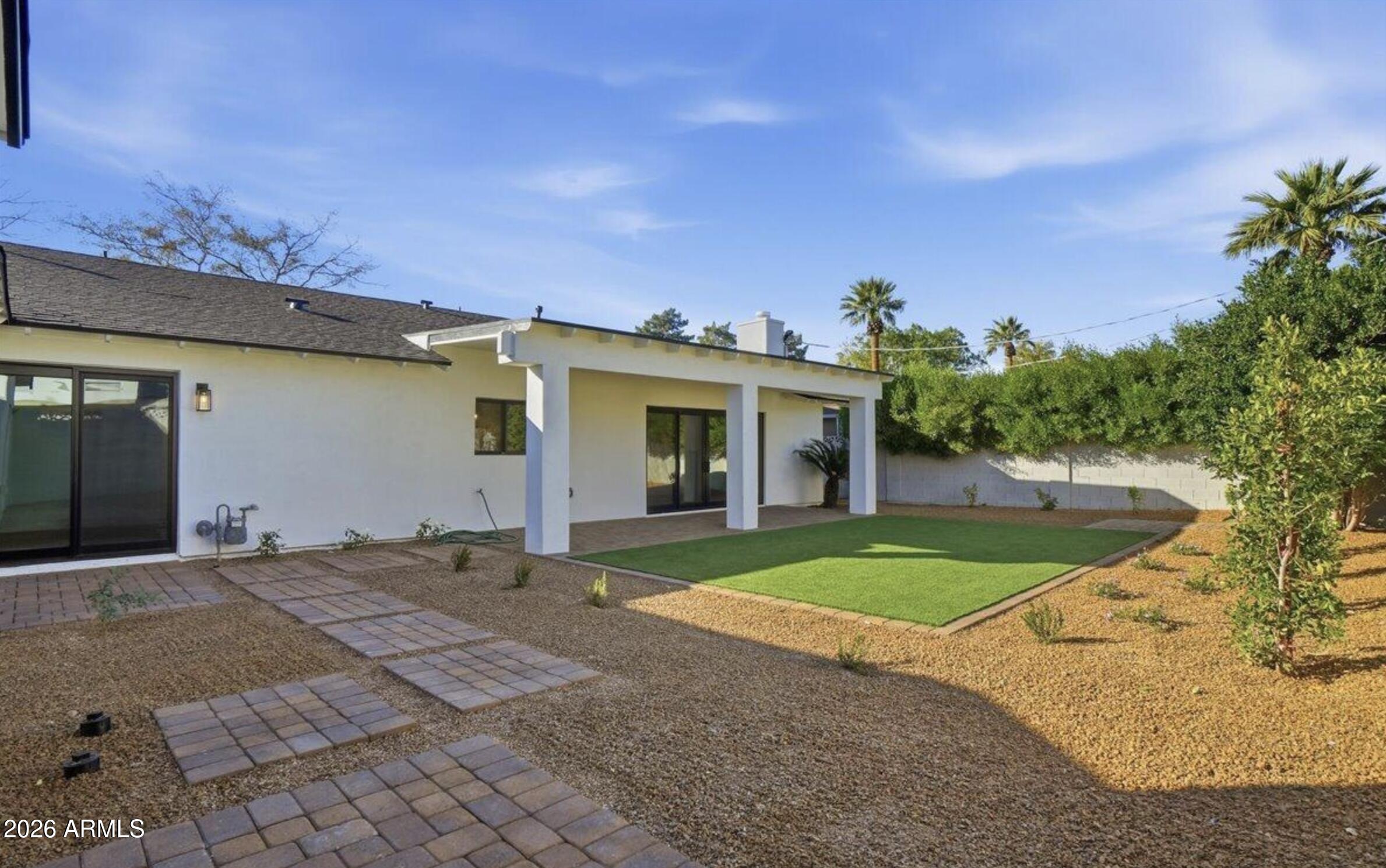 4515 North 35th Street Phoenix, AZ 85018 - Photo 34 of 36 a front view of a house with a yard and potted plants