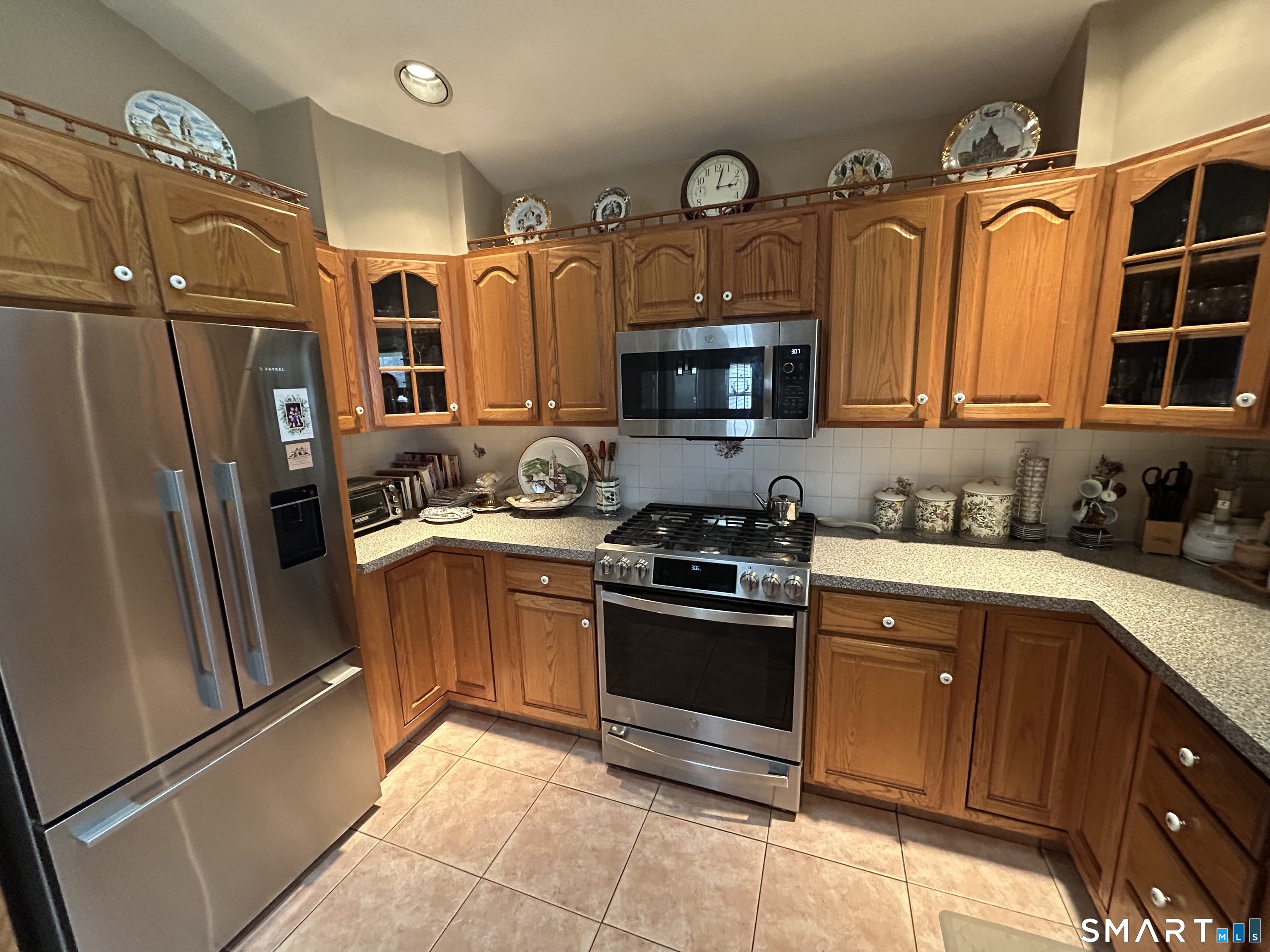 720 Circular Avenue Hamden, CT 06514 - Photo 11 of 35 a kitchen with stainless steel appliances granite countertop a refrigerator a stove a sink and a microwave