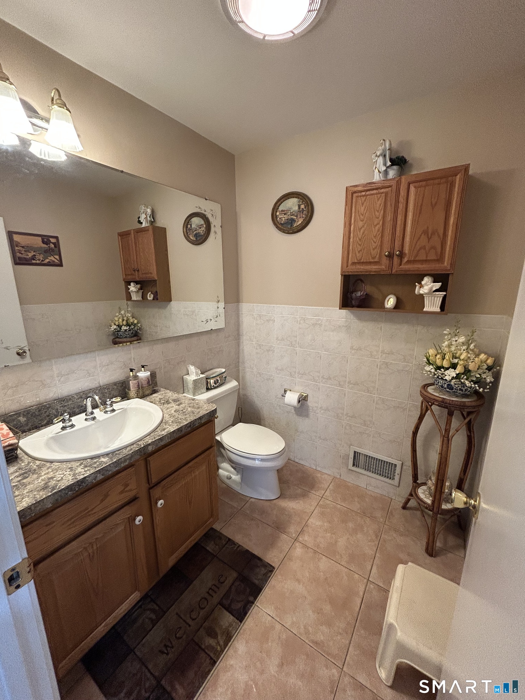 720 Circular Avenue Hamden, CT 06514 - Photo 15 of 35 a bathroom with a toilet sink and mirror