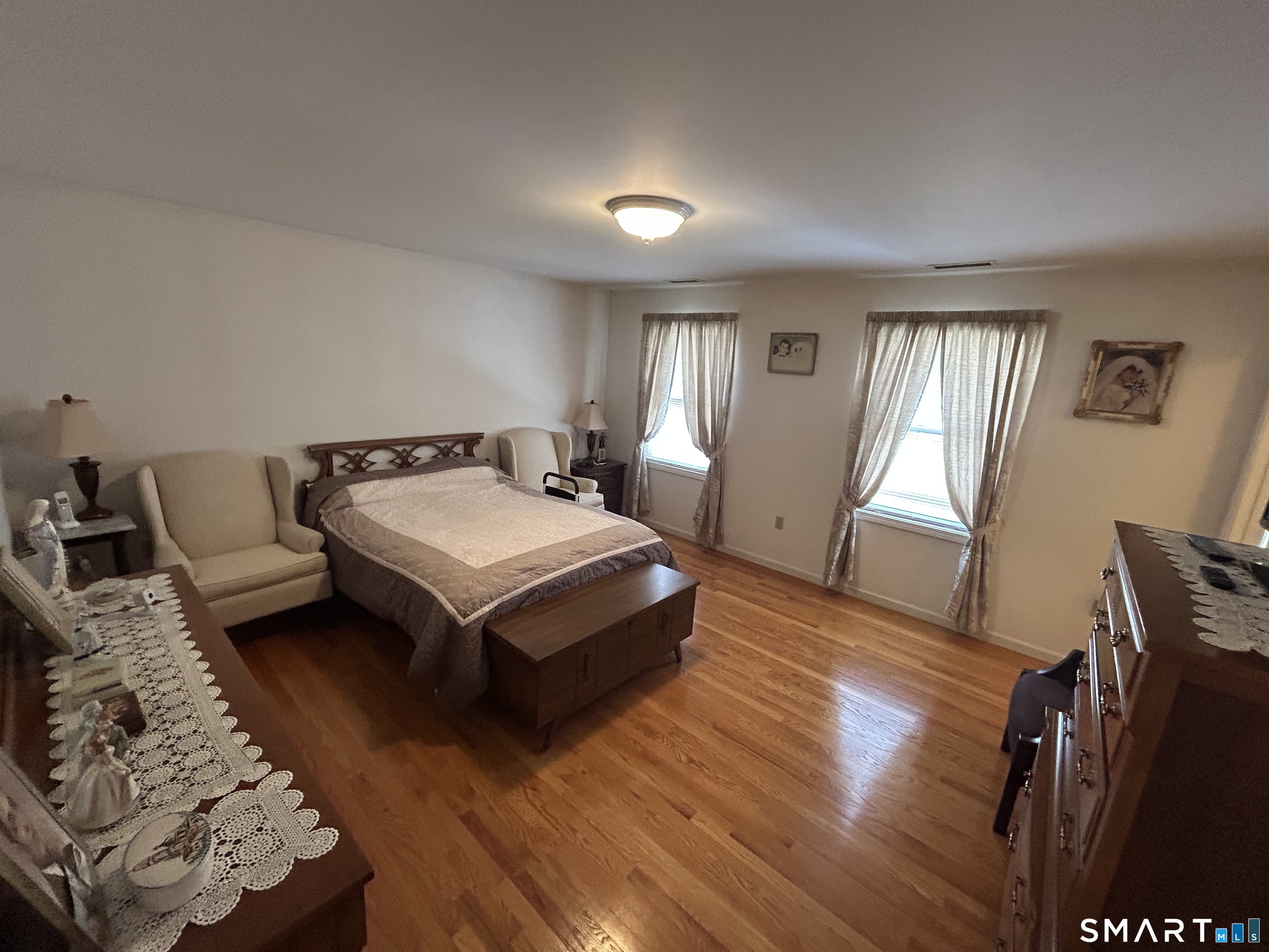 720 Circular Avenue Hamden, CT 06514 - Photo 18 of 35 a bedroom with furniture and a window