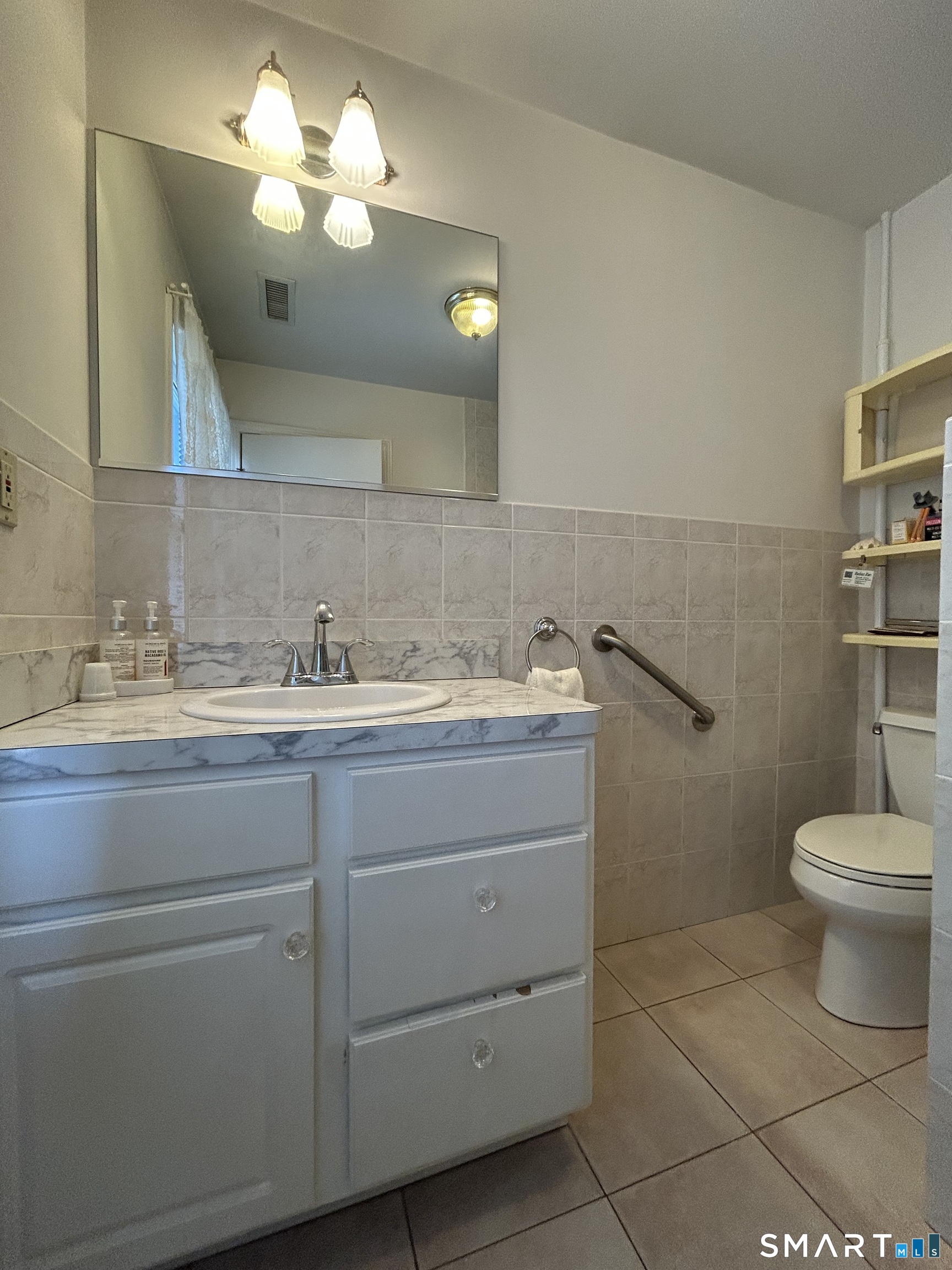 720 Circular Avenue Hamden, CT 06514 - Photo 20 of 35 a bathroom with a toilet sink and mirror