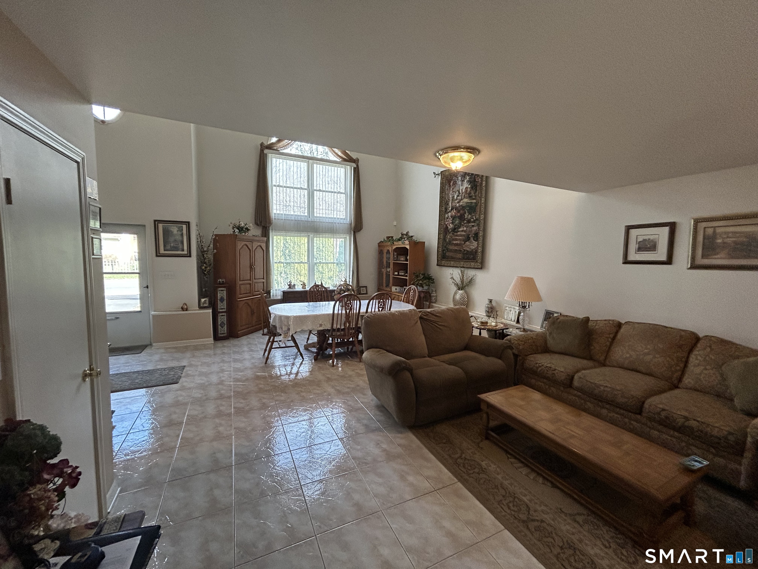 720 Circular Avenue Hamden, CT 06514 - Photo 2 of 35 a living room with furniture and a large window