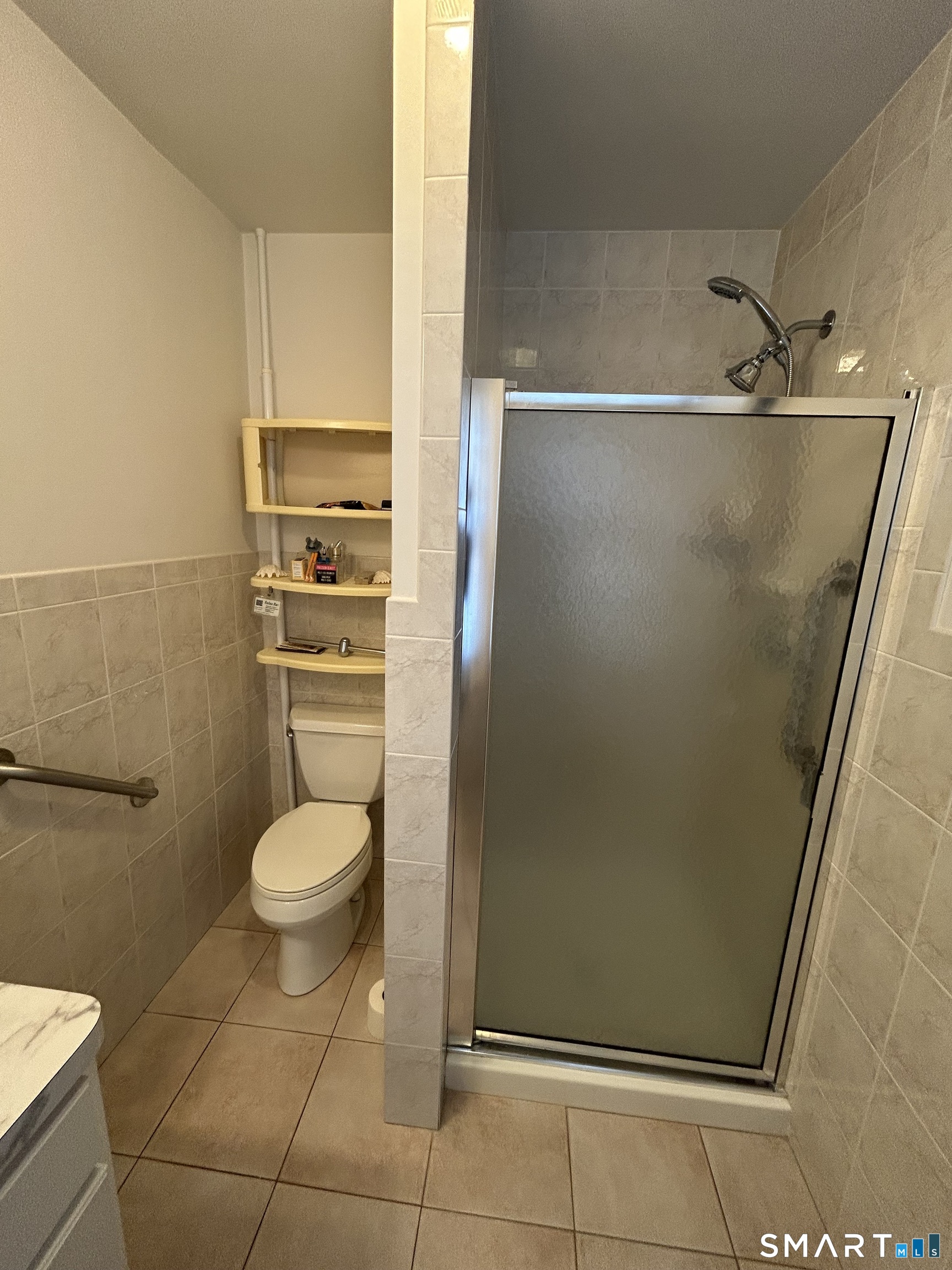 720 Circular Avenue Hamden, CT 06514 - Photo 21 of 35 a bathroom with a toilet and a shower