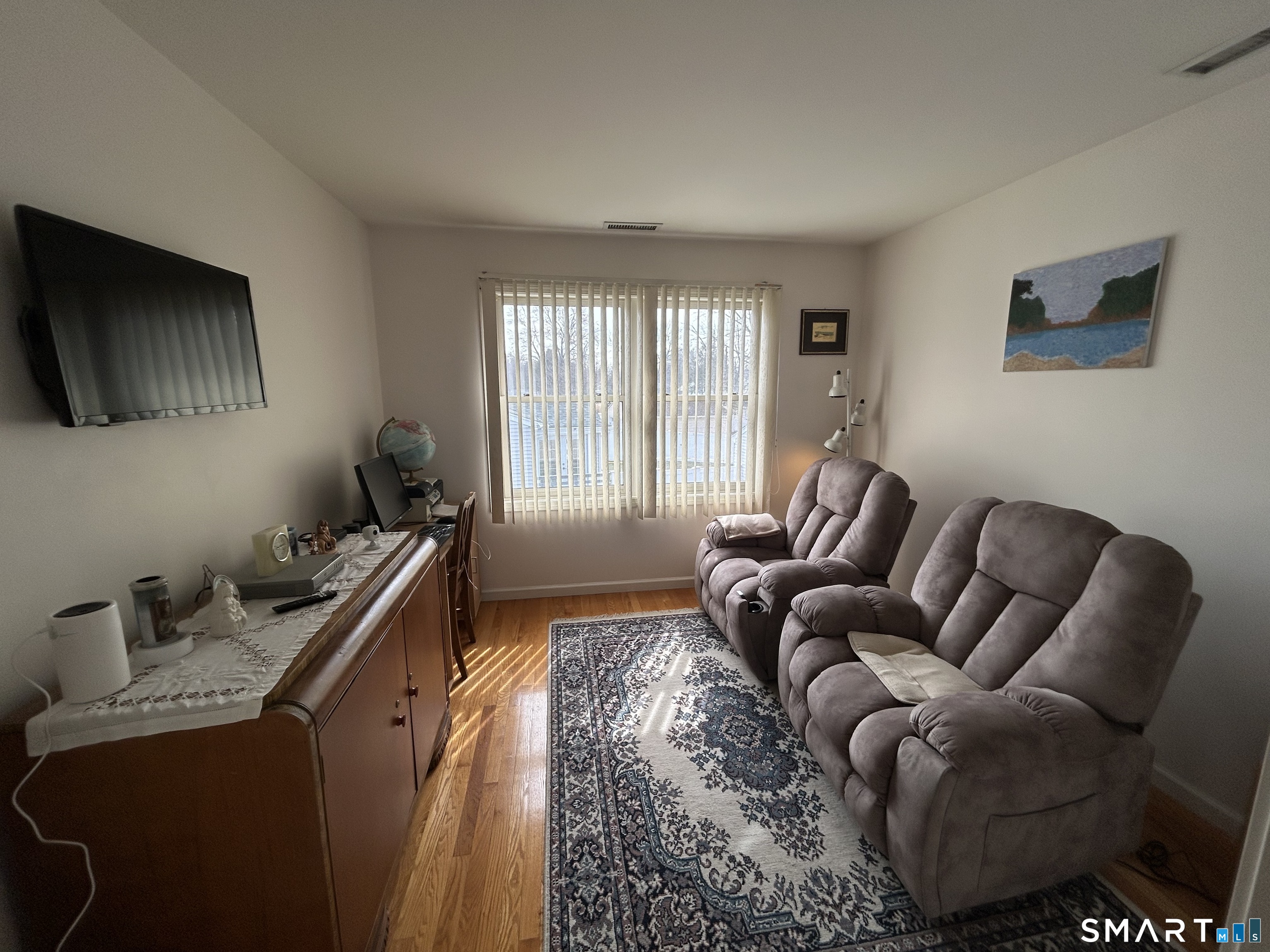 720 Circular Avenue Hamden, CT 06514 - Photo 22 of 35 a living room with furniture and a flat screen tv