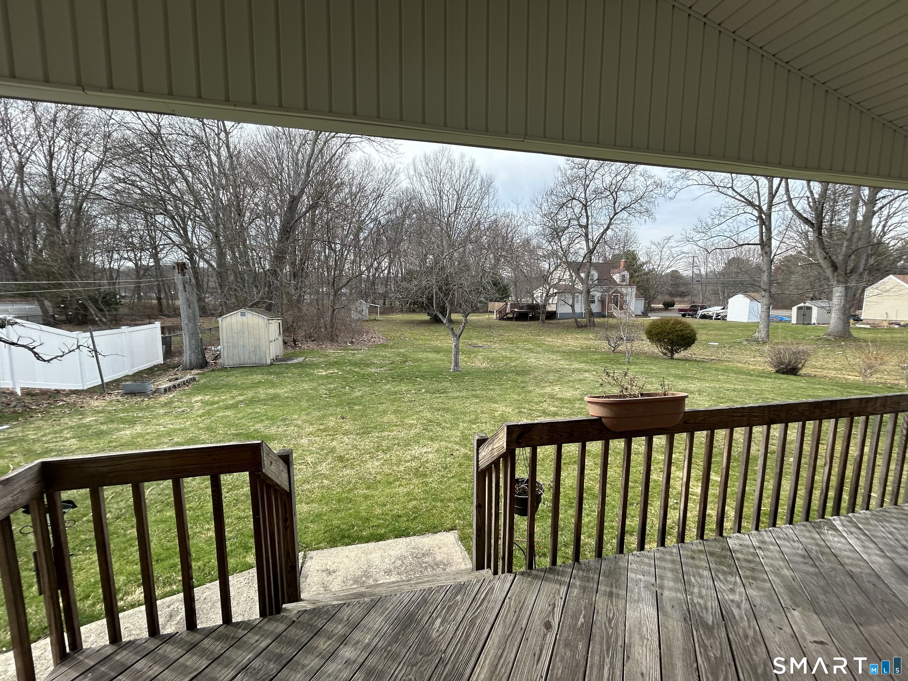 720 Circular Avenue Hamden, CT 06514 - Photo 26 of 35 a view of a wooden deck and floor with a yard