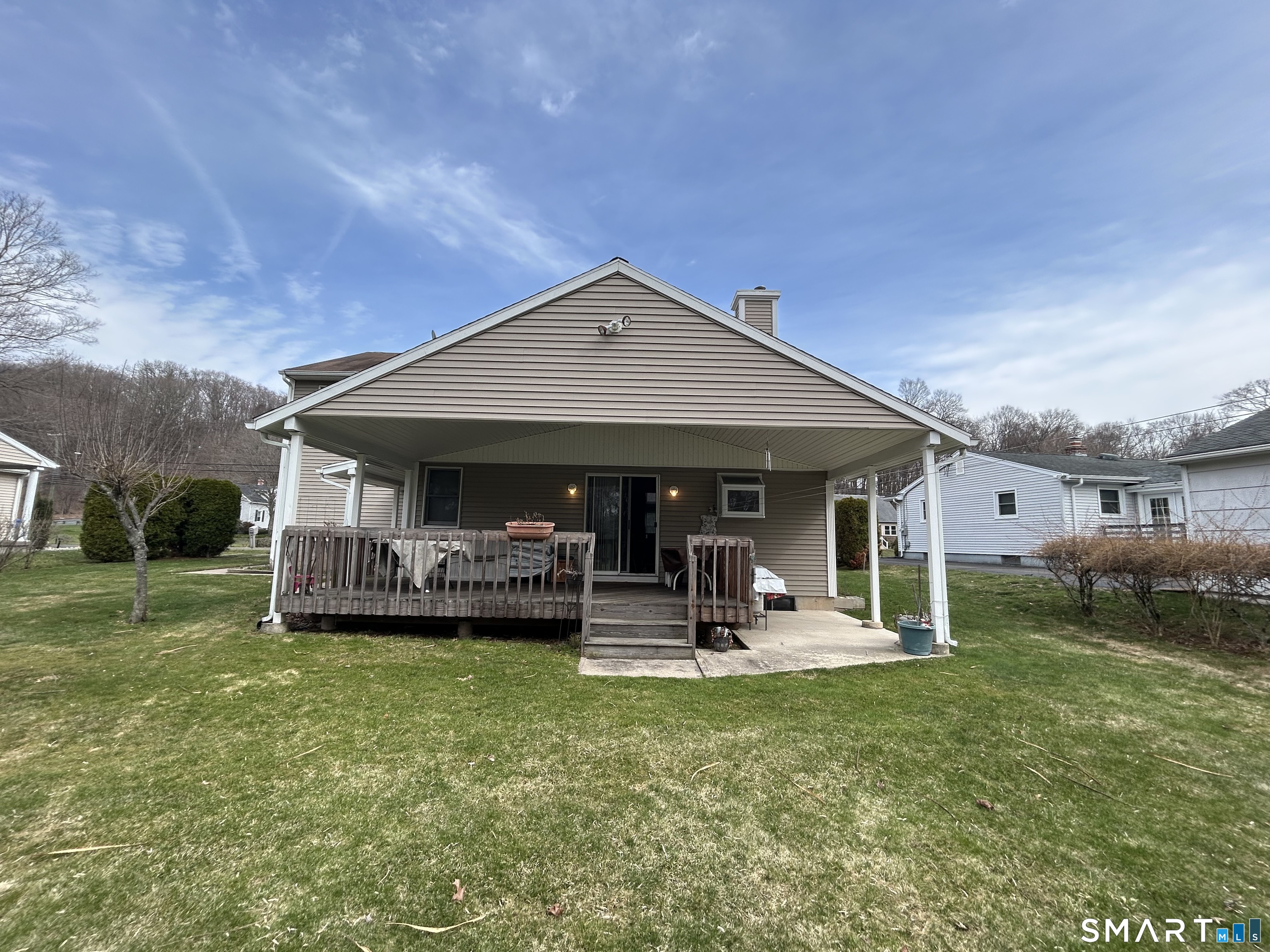 720 Circular Avenue Hamden, CT 06514 - Photo 27 of 35 a front view of a house with a garden and trees
