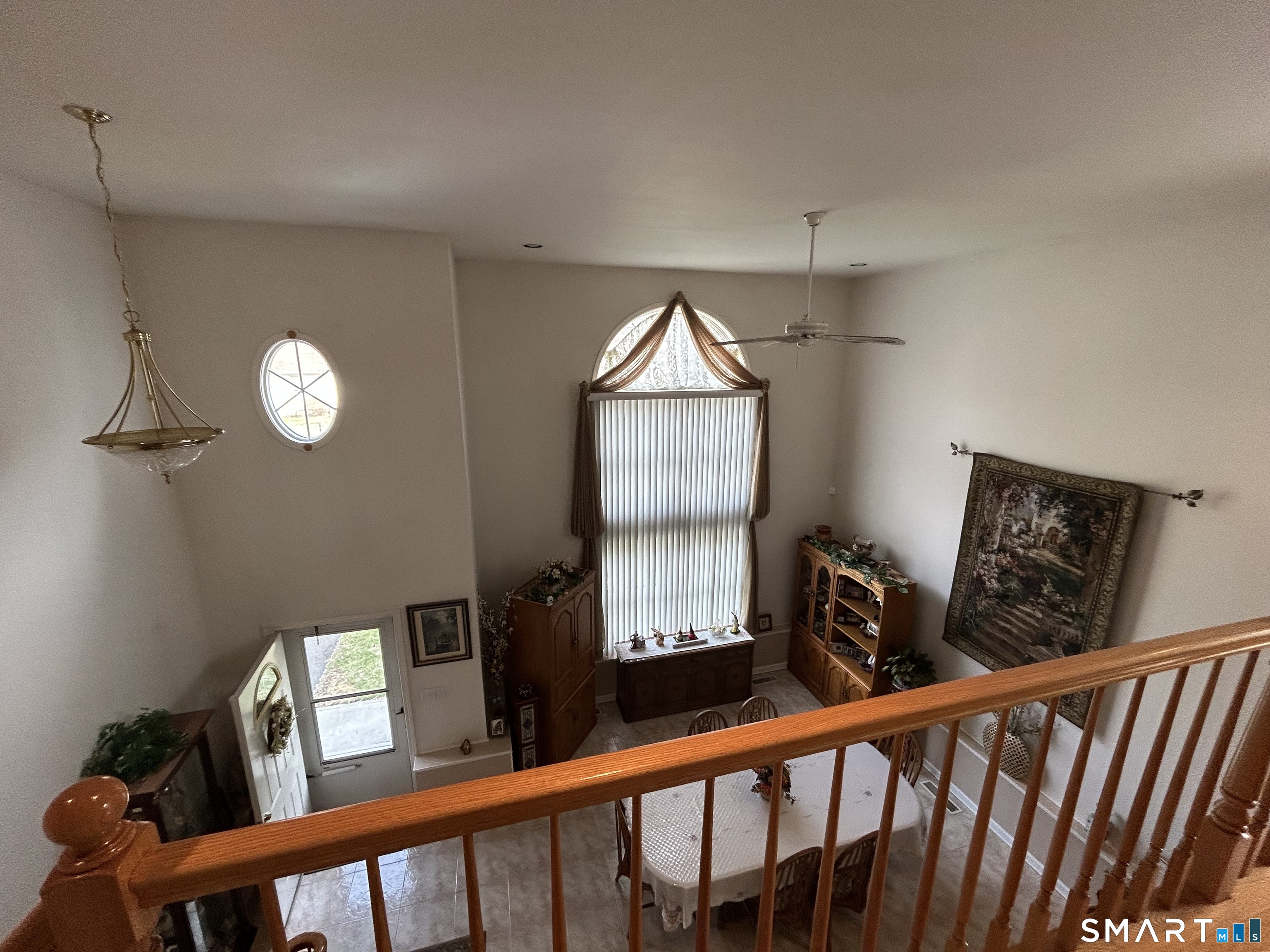 720 Circular Avenue Hamden, CT 06514 - Photo 3 of 35 a view of a hallway with wooden floor and windows