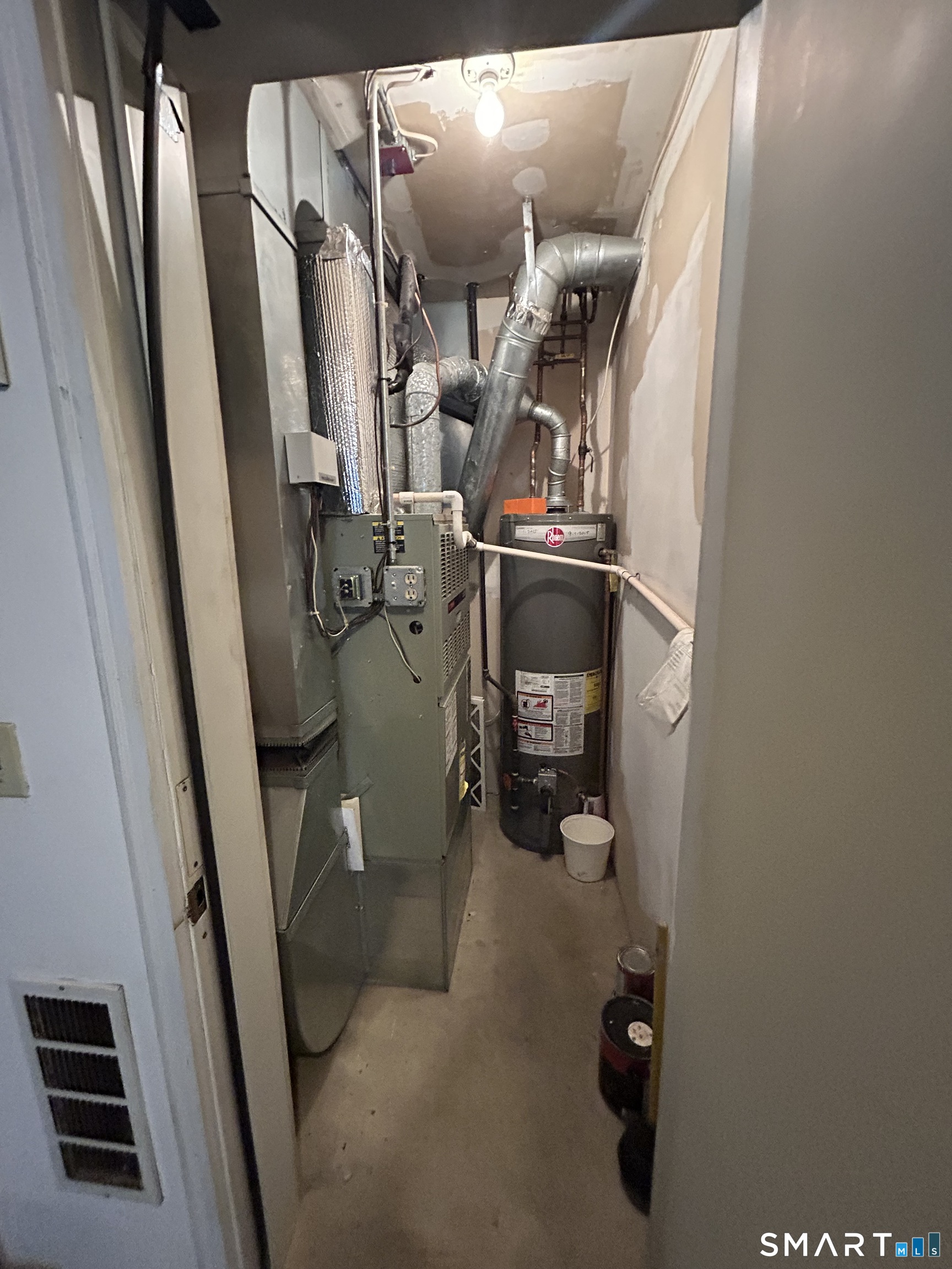 720 Circular Avenue Hamden, CT 06514 - Photo 32 of 35 a view of walk in closet with clothes and shoes