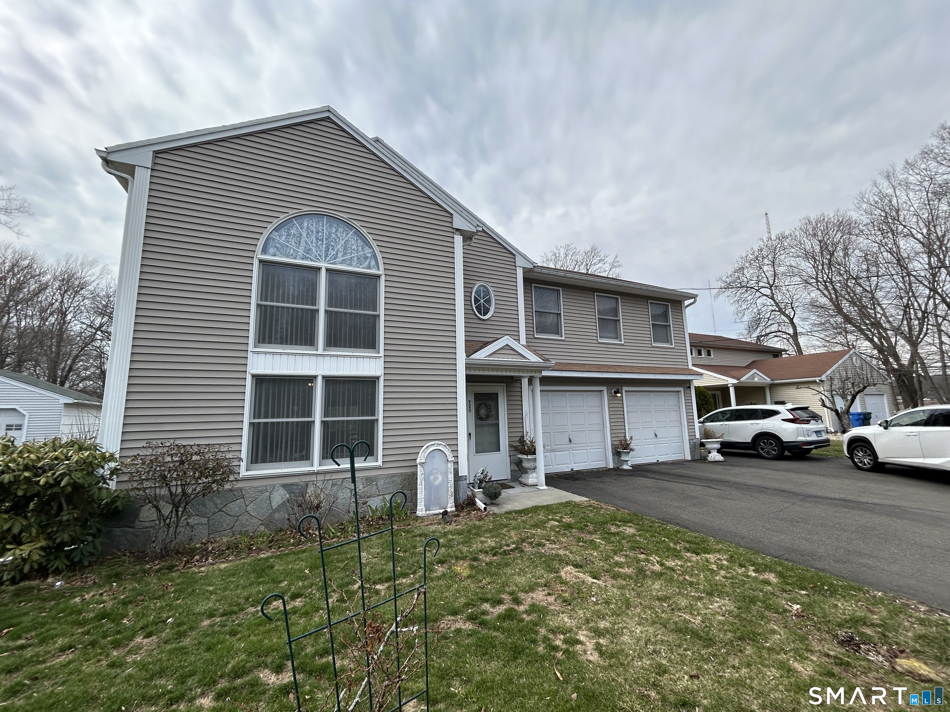 720 Circular Avenue Hamden, CT 06514 - Photo 34 of 35 a front view of a house with a yard