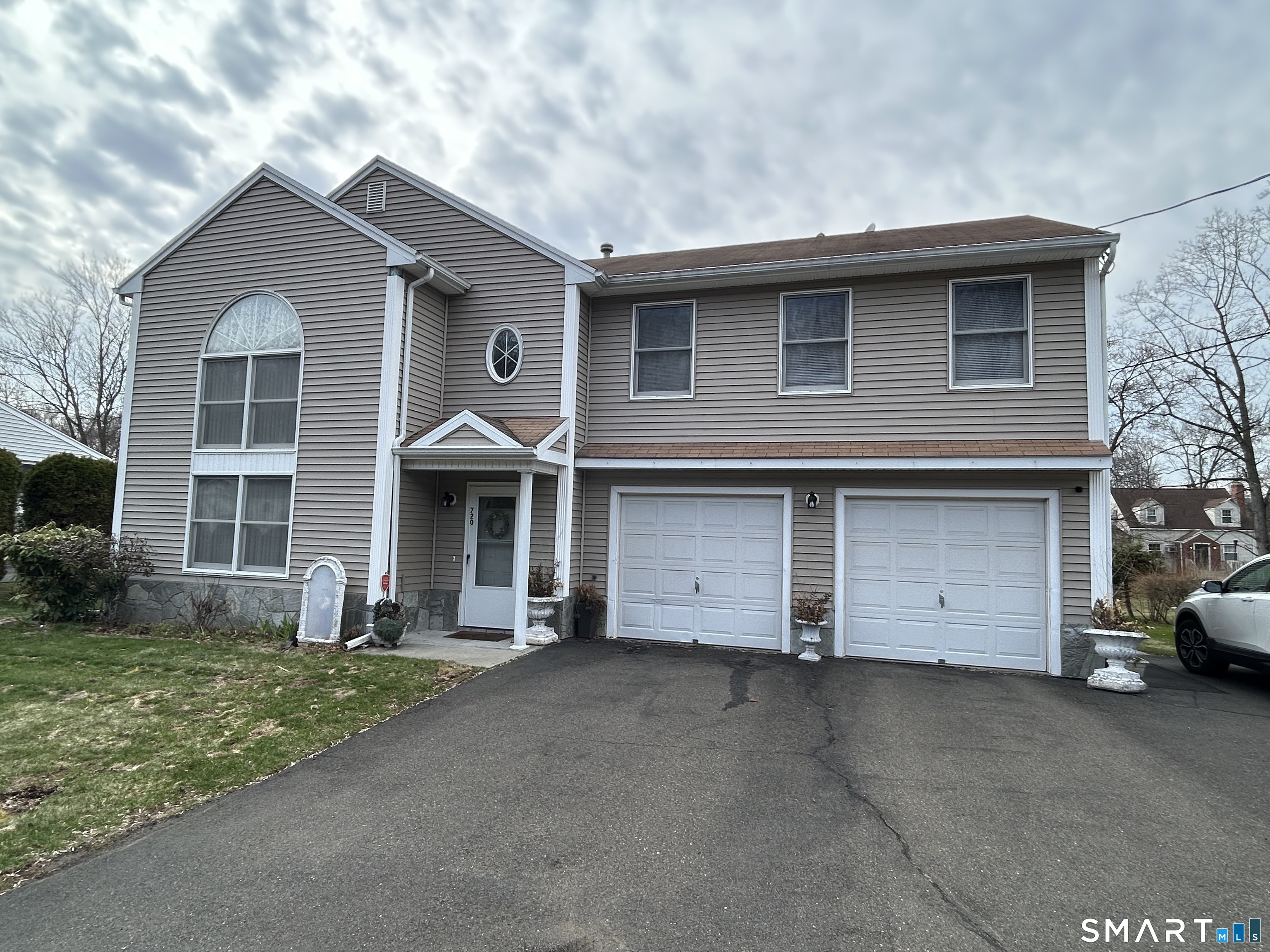 720 Circular Avenue Hamden, CT 06514 - Photo 35 of 35 a front view of a house with a garden