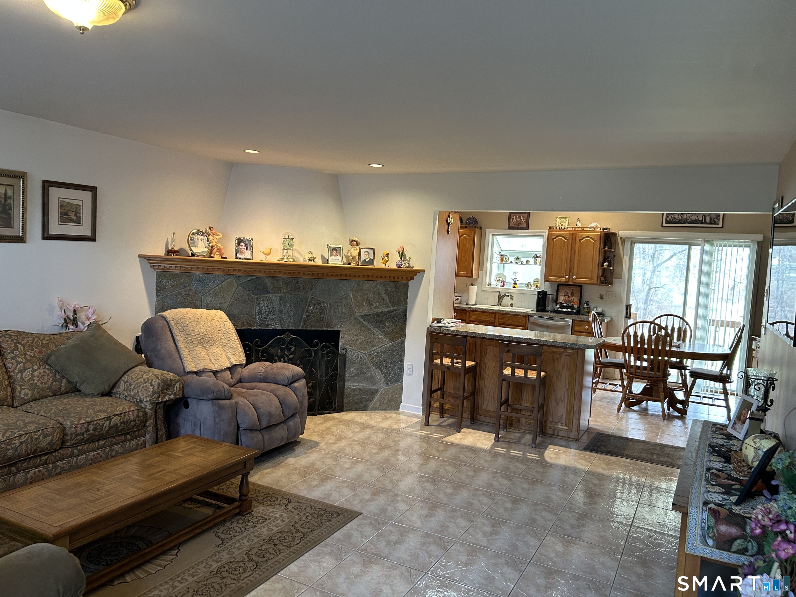 720 Circular Avenue Hamden, CT 06514 - Photo 9 of 35 a living room with furniture and a fireplace