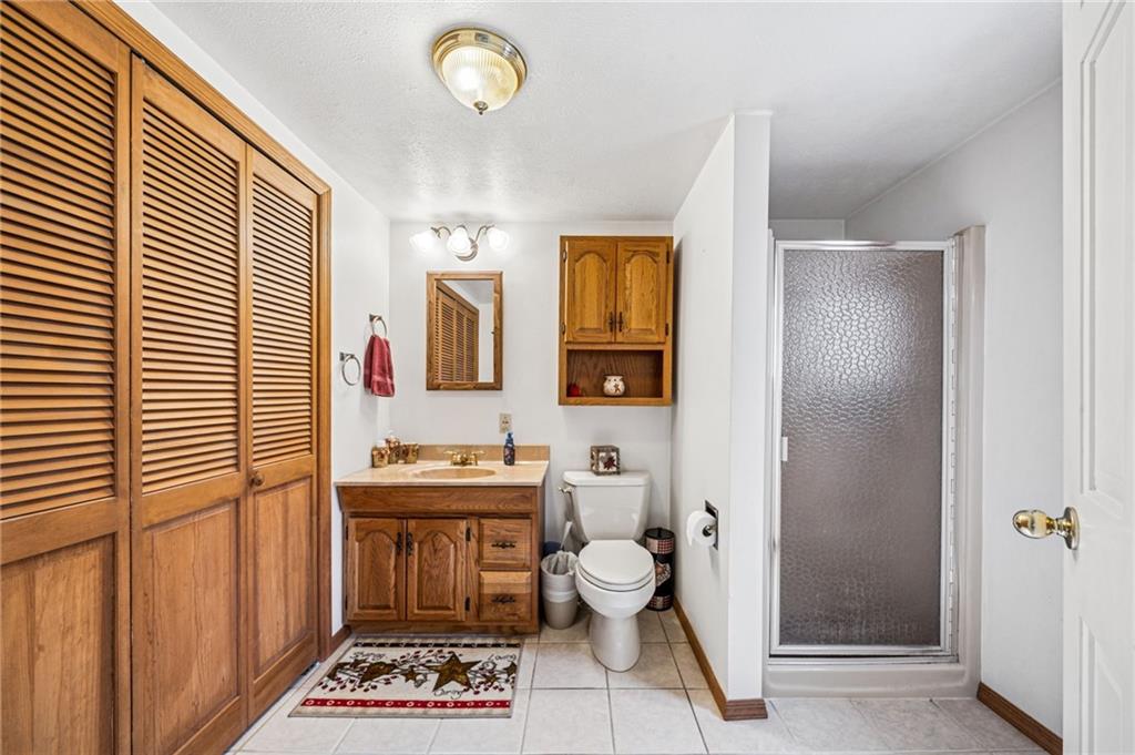 1813 Service Lane Monessen, PA 15062 - Photo 18 of 31 a bathroom with a sink a toilet and shower