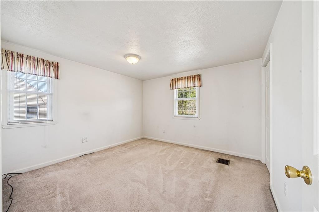 1813 Service Lane Monessen, PA 15062 - Photo 19 of 31 an empty room with windows