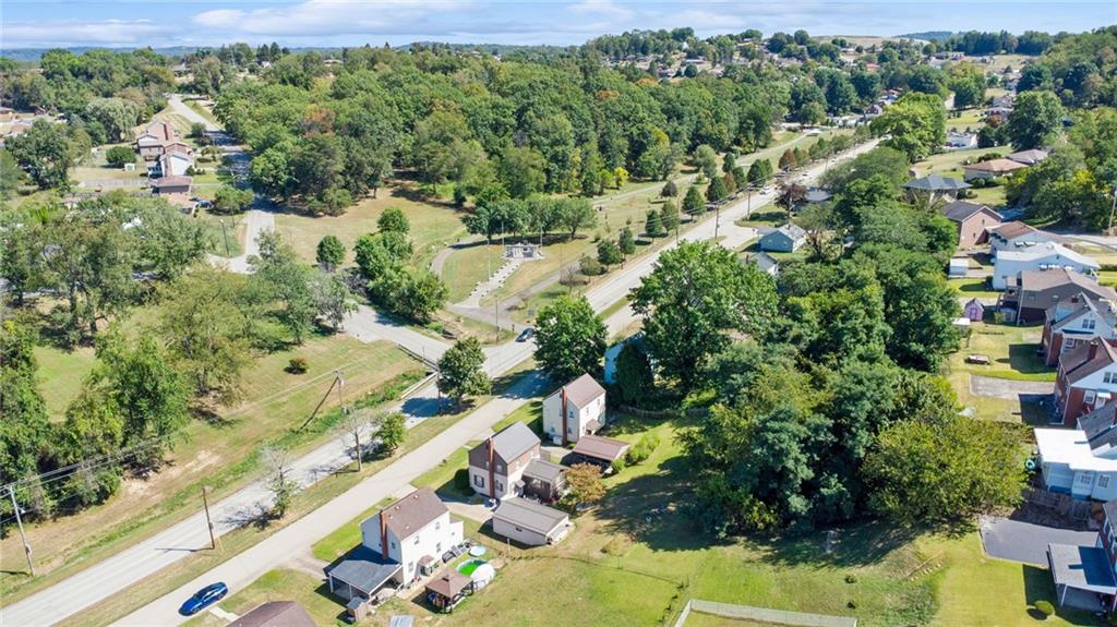 1813 Service Lane Monessen, PA 15062 - Photo 31 of 31 an aerial view of residential houses with outdoor space and trees
