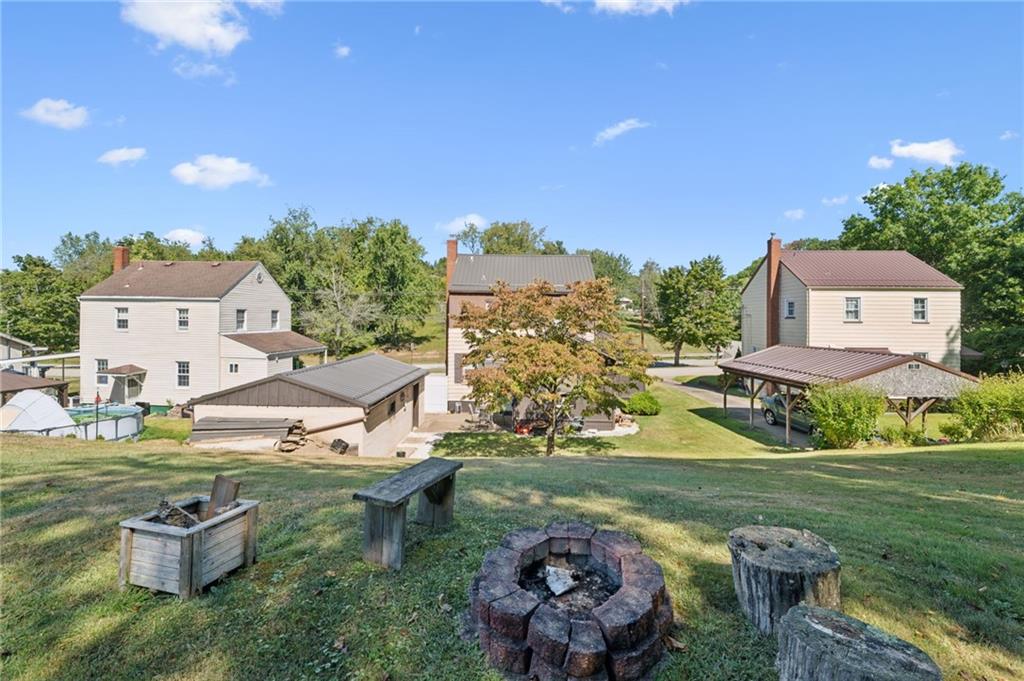 1813 Service Lane Monessen, PA 15062 - Photo 4 of 31 an aerial view of a house with garden space and street view