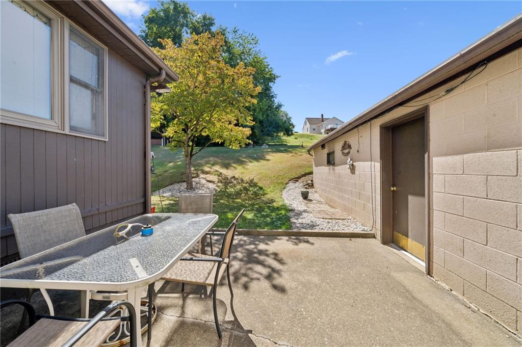 1813 Service Lane Monessen, PA 15062 - Photo 6 of 31 a view of a patio with table and chairs and potted plants