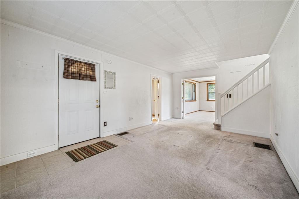 1813 Service Lane Monessen, PA 15062 - Photo 8 of 31 a view of an empty room with stairs