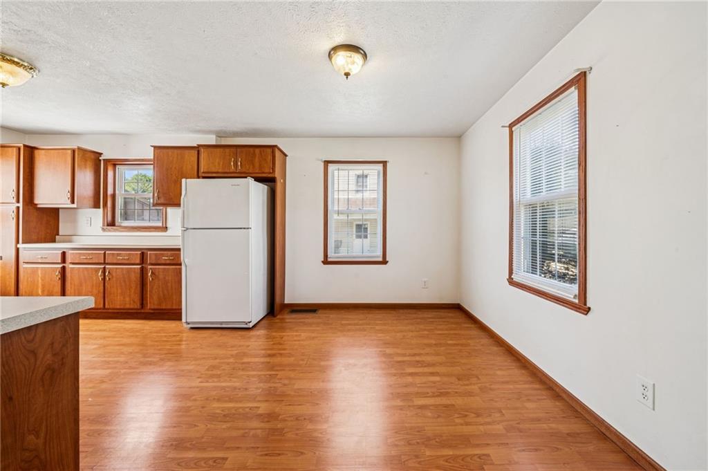 1813 Service Lane Monessen, PA 15062 - Photo 10 of 31 a view of a kitchen with fridge and workspace