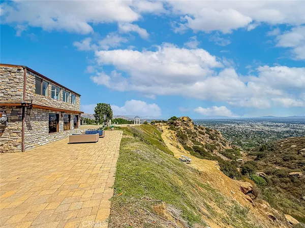 a view of a swimming pool with an outdoor seating