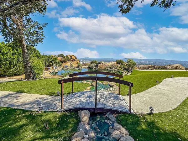 a room with a bed and a dresser