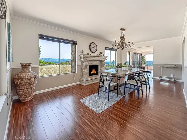 a view of a livingroom with furniture window and wooden floor