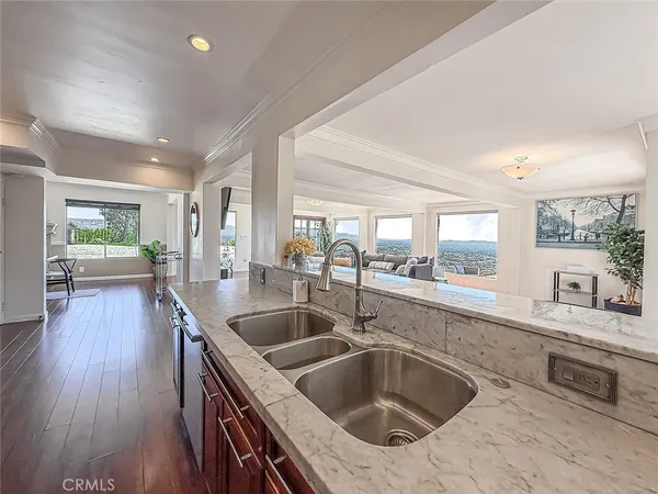 a kitchen with a sink and a refrigerator
