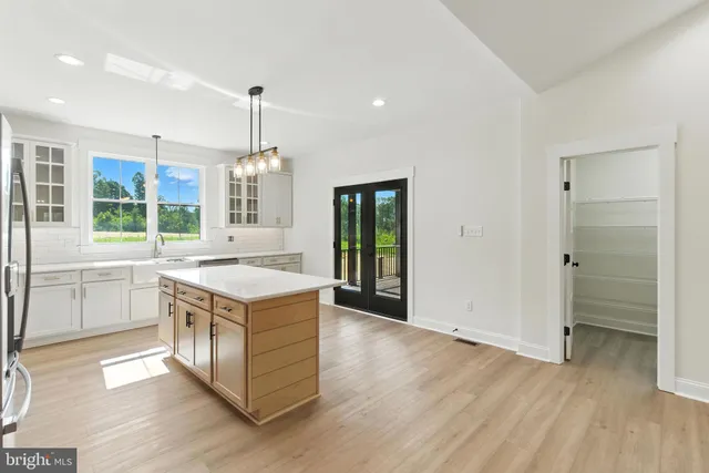 a kitchen with a stove and a sink